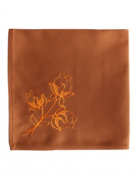 Napkin in pure cotton, rusty colour, embroidered with lotus flowers, made in France