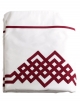 White top sheet embroidered with red ribbons